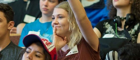 undergraduate student raising hand